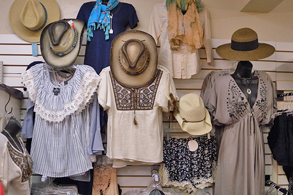 display of blouses and ladies' cowboy hats