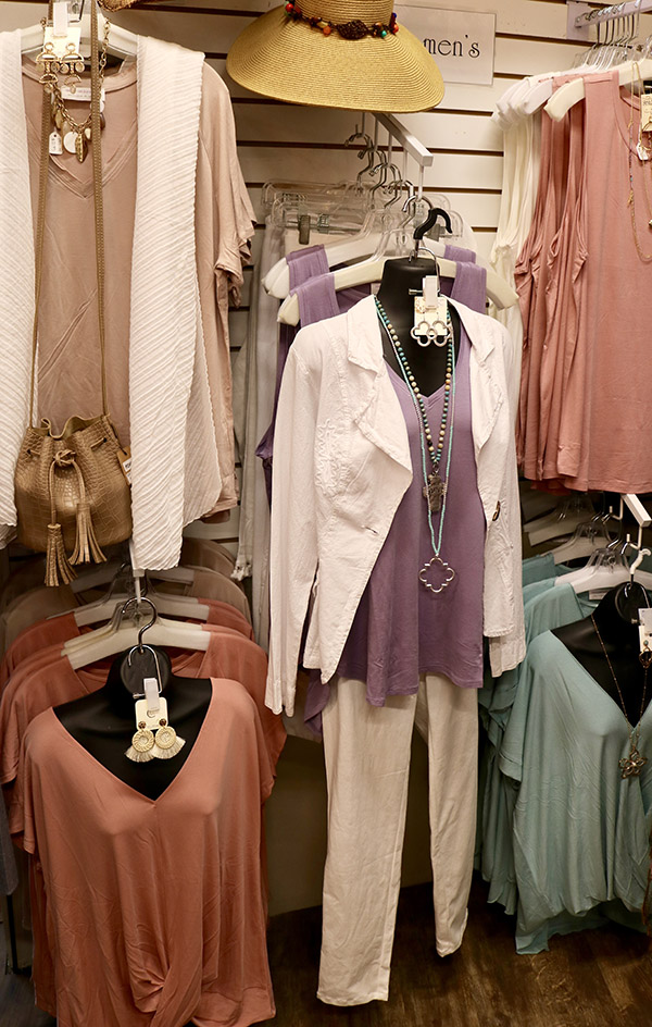 wall of blouses and jewelry