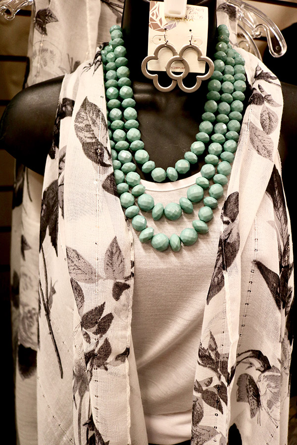 white blouse and necklace